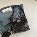 Chic black sequin shoulder bag with adjustable strap and fashion logo tag - Black