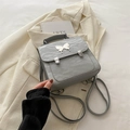 Mini grey butterfly backpack in wrinkled faux leather with metallic butterfly buckle - Silver