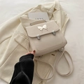 Cream PU leather square backpack for women featuring a stylish silver butterfly buckle - White