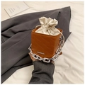 Detail of caramel leather square bag with white drawstring liner and silver chain - Brown