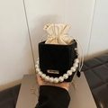 Elegant black velvet bucket bag with pearl handle and golden chain shoulder strap - Black