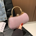 Elegant pink sequin evening bag with golden handle and crystal clasp handheld shot - Evening Bag / Pink
