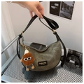 Detail of army green canvas hobo bag with black leather straps and plush monster charm - With Pendant / Dark Brown
