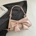 Pink crescent underarm bag with large bow detail and knotted handle in leather finish - Pink