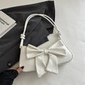 Elegant white shoulder bag with large bow detail and stylish sphere strap knots - White