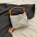 Chic floral jacquard shoulder bag with natural wooden bead handle and blue embroidery - Blue