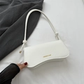 White faux crocodile leather shoulder bag with gold text and decorative knotted strap - White