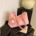 Pink popcorn textured pleated shoulder bag with floral pendant and gold hardware - Pink