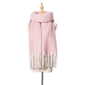 Soft pink chunky knit scarf with long tassels displayed on a wooden mannequin torso - Pink