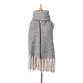 Grey chunky knit scarf with long cream tassels for winter warmth on a mannequin - Gray