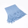 Light blue waffle knit scarf for winter with long tassel fringe detail on white background - Blue
