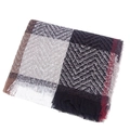 Close-up of a soft checkered scarf with classic herringbone pattern and fine tassels - Gray