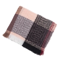 Detail showing zigzag knit texture and tassel fringe on multicolored plaid winter scarf - Nude Pink