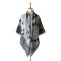 Grey and black geometric cashmere-feel scarf with tassels on a mannequin - Black