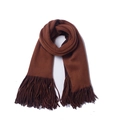 Close-up of thick brown knit scarf showing ribbed texture and long tassel details - Caramel and Brown