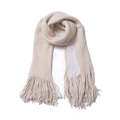 Close-up of thick beige winter scarf featuring dense tassel details and soft knit texture - White + Beige