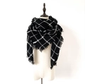 Classic black and white checkered oversized scarf with fringe on a mannequin - Black