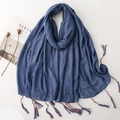 Solid navy blue cotton linen scarf with colorful tassel edges for women over white background - Denim Blue