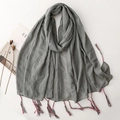 Grey cotton linen scarf with tassel charms and pleated texture on white background - Gray