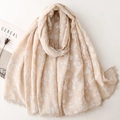Detailed close-up of beige cotton linen scarf with floral embroidery and lace trim - Khaki