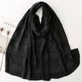 Detail of black pleated scarf showing rich crinkle texture and soft elegant fabric draping - Black (SL2511-007)