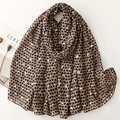 Lightweight scarf with heart prints and gold foil details on a light brown fabric base - Brown