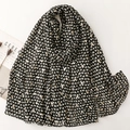 Elegant black shawl with gold and white heart prints, styled with minimalist magazine - Black