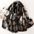 Black cotton-linen feel scarf with geometric circle prints and delicate fringe edge - Black