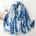 Blue and white tropical leaf pattern scarf with gold outlines and frayed edges - Blue