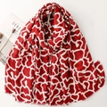 Red and white geometric giraffe print scarf with fringe edges on a white background - Red