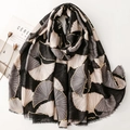 Elegant black cotton linen scarf with gold ginkgo leaf print and delicate fringe edges - Black