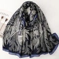 Navy blue cotton linen scarf with elegant white floral print and tropical leaf patterns - Blue Trim