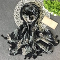 Detail of tropical leaf print and bicolored fringe tassels on black linen shawl - 180x100cm / Black