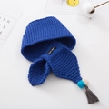 Detailed shot of dark blue knit hat with colorful pom-poms, tassels and Hand Made label - 66*10cm / Blue