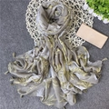 Detail of tropical leaf print scarf with tassels on textured grey background - 180x100cm / Gray