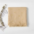 Detailed view of beige cotton linen scarf with gold foil deer pattern and tassel trim - Beige