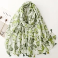 White scarf with green ginkgo leaf print and tassels for sun protection and travel - Green