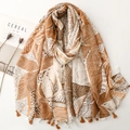 Lightweight scarf with tropical palm leaf print and delicate tassels on plain background - Khaki