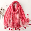 Close-up of pink floral scarf showing gold silk stripes and decorative edge tassels - Rose Pink