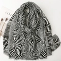 Zebra pattern print long scarf with frayed edges for sun protection and travel wear - Black