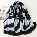 Detail of zebra pattern winter scarf with raw edges and navy grey geometric lines - Blue (SL2412-014)