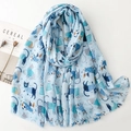 Detail of light blue cotton scarf featuring cute cat print and winter snowflakes pattern - Cat Print / Blue