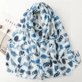 Detailed view of light blue cartoon cat print and fringe edges on a soft cotton scarf - Blue (SL2502-007)