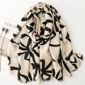 Minimalist cream linen scarf with black abstract floral pattern and frayed edges - Beige