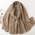 Classic leopard print scarf with fringe edges shown in a minimalist flat lay lifestyle view - 180*88cm / Khaki (SL2410-019)