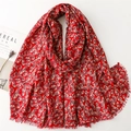 Red cotton linen scarf with white ginkgo leaf pattern and fringe edges displayed on white - Red