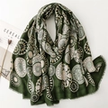 Detail of dark green cotton linen scarf with gold mandala patterns and tassel edges - Green