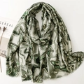 Artistic green cotton linen scarf with gold wavy patterns and frayed edges on white surface - 180*88cm / Green