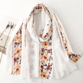 White cotton linen scarf with vibrant floral embroidery and bohemian style finish - White