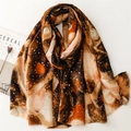 Detailed macro shot of abstract pattern pashmina scarf with stylish fringed edges - Brown